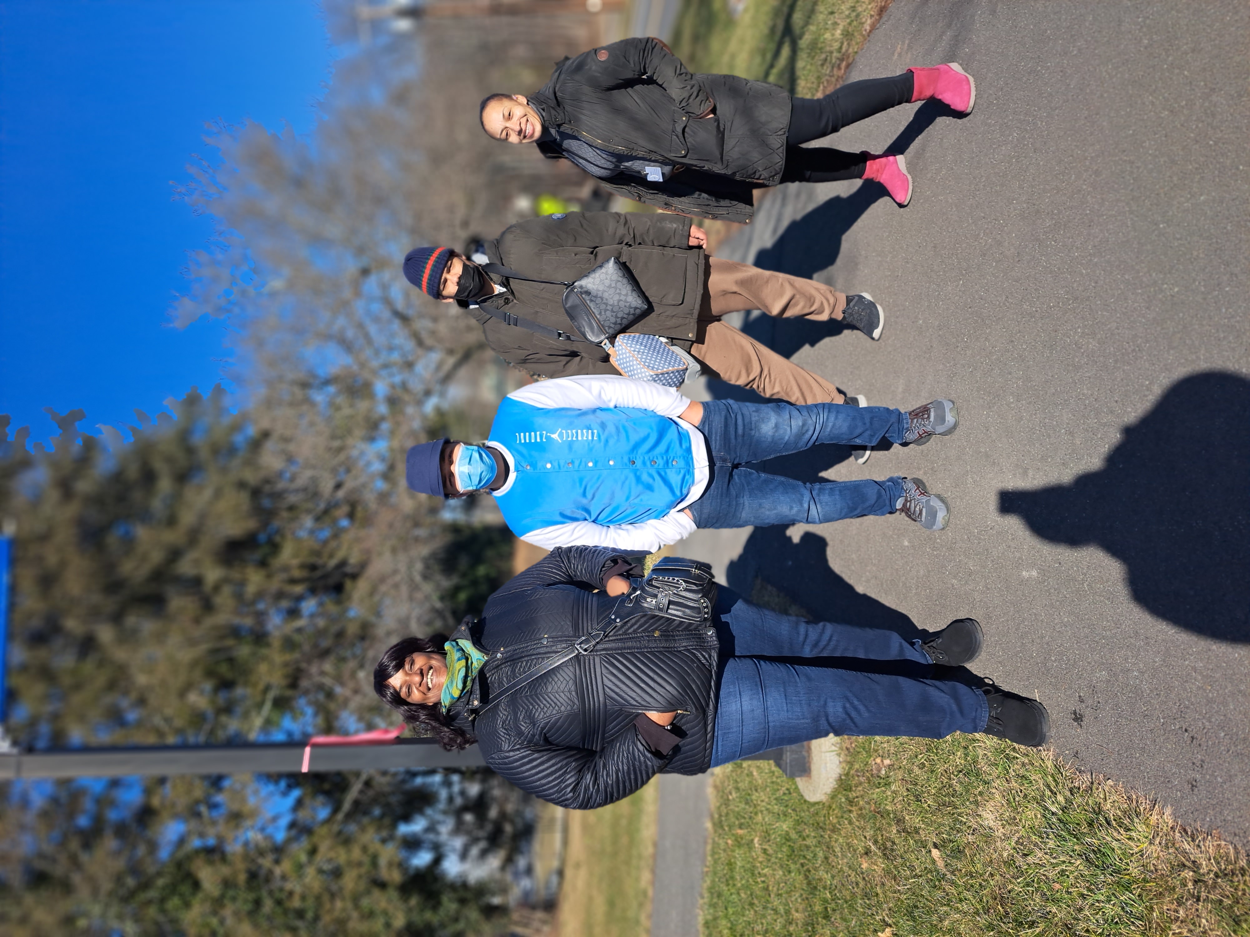 The transition instructors pose with students outside on a chilly day