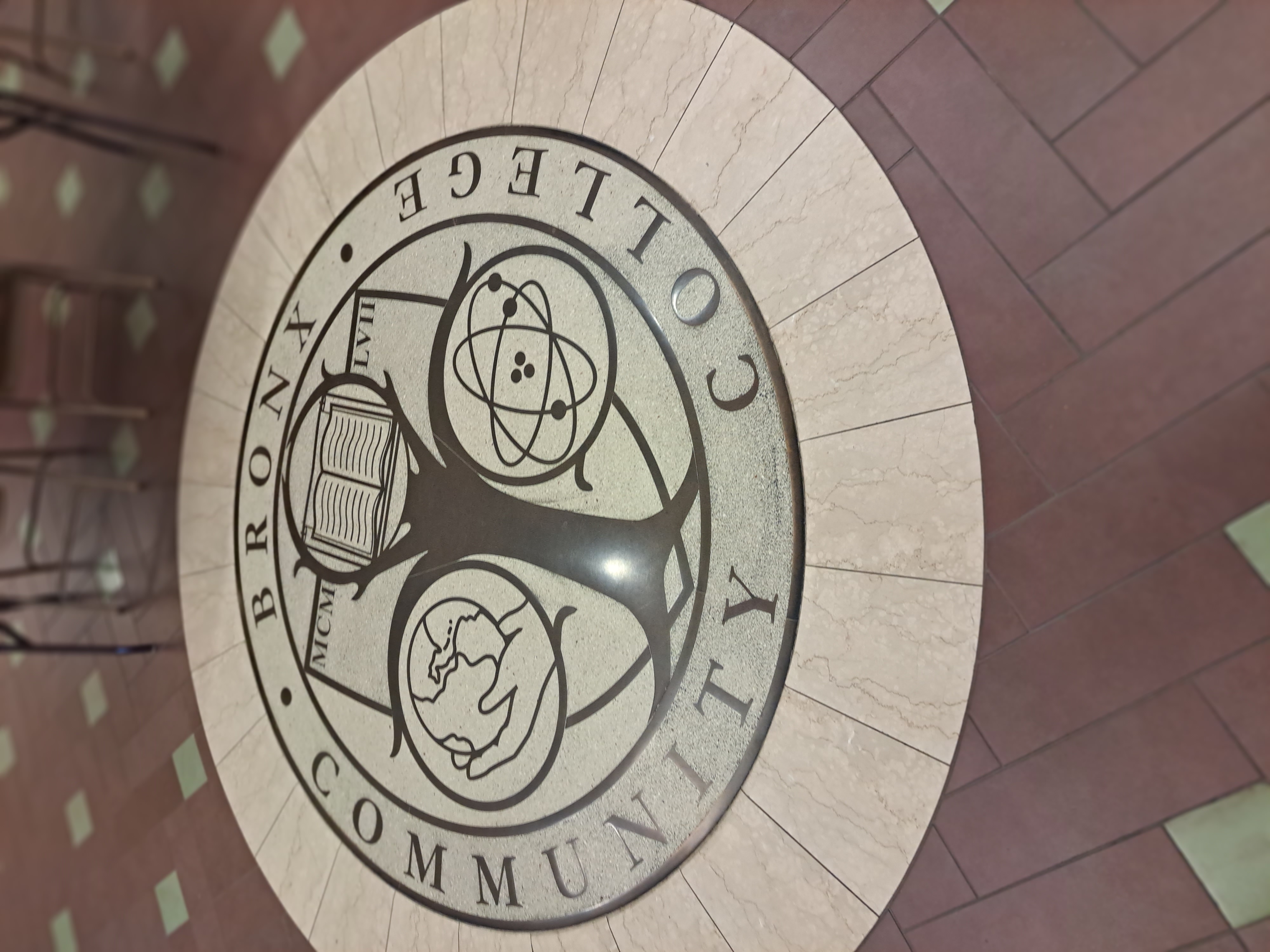 A photo of the floor showing the logo of Bronx community college