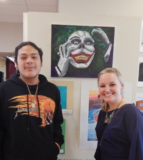 student and staff with art work