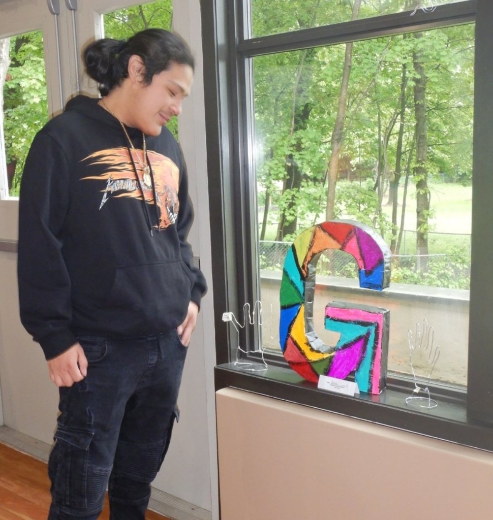 student with art work