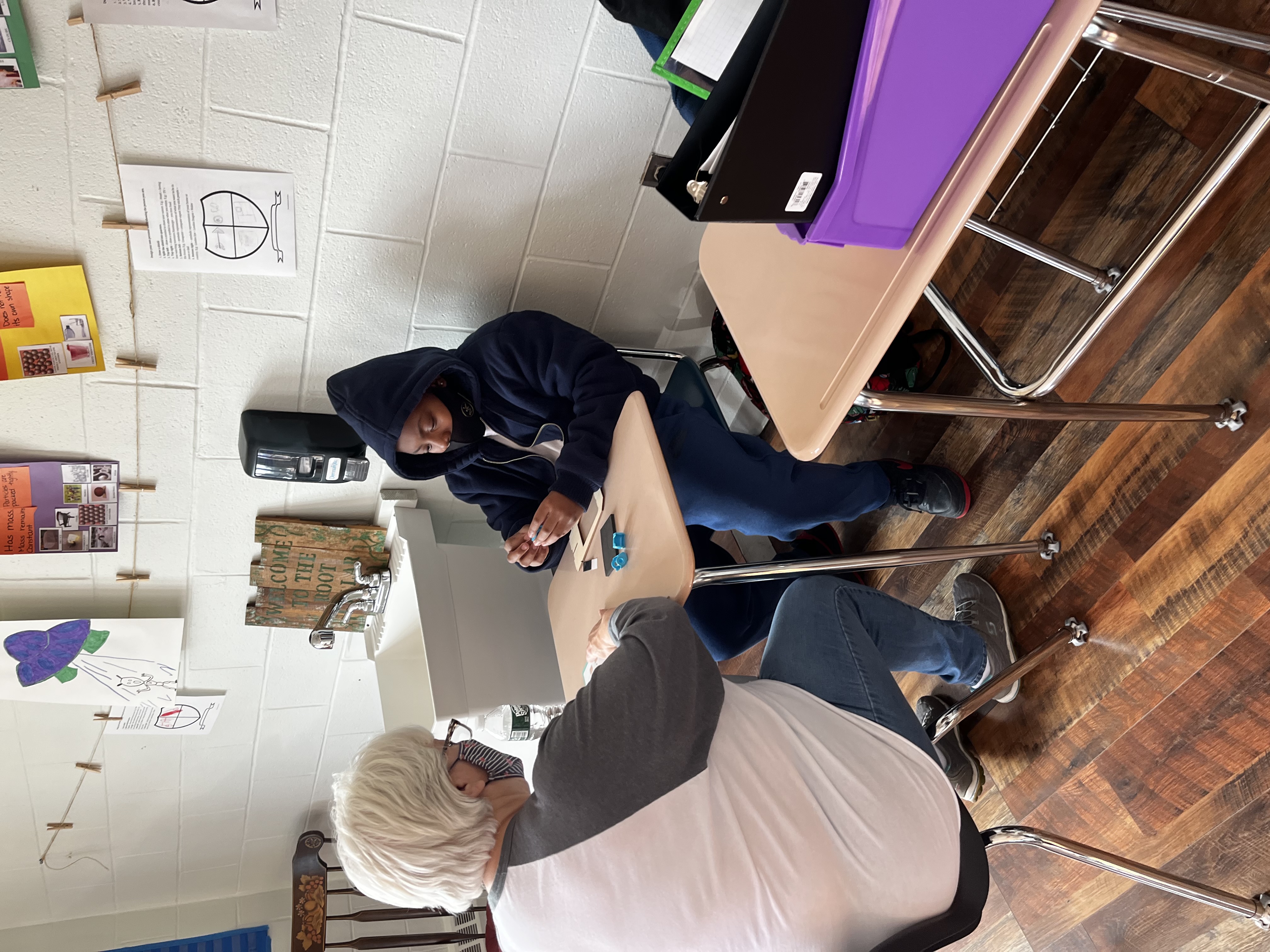 Students working on project with staff