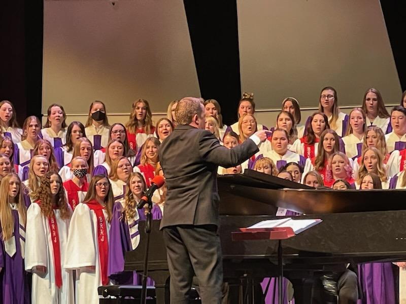 Dr. Ryan Murphy conducting choir students from BEHS and BRHS