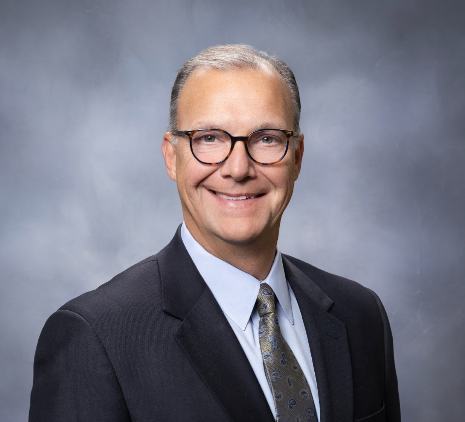 Scot T. Prebles, Superintendent photo, showing a smiling man with glasses in a suit.