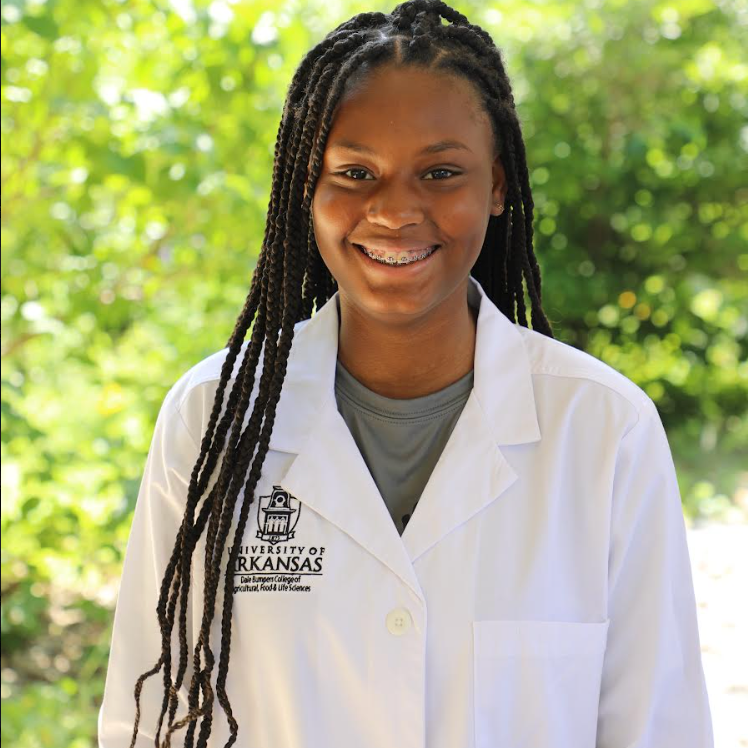 Girl Smiling in Lab Coat