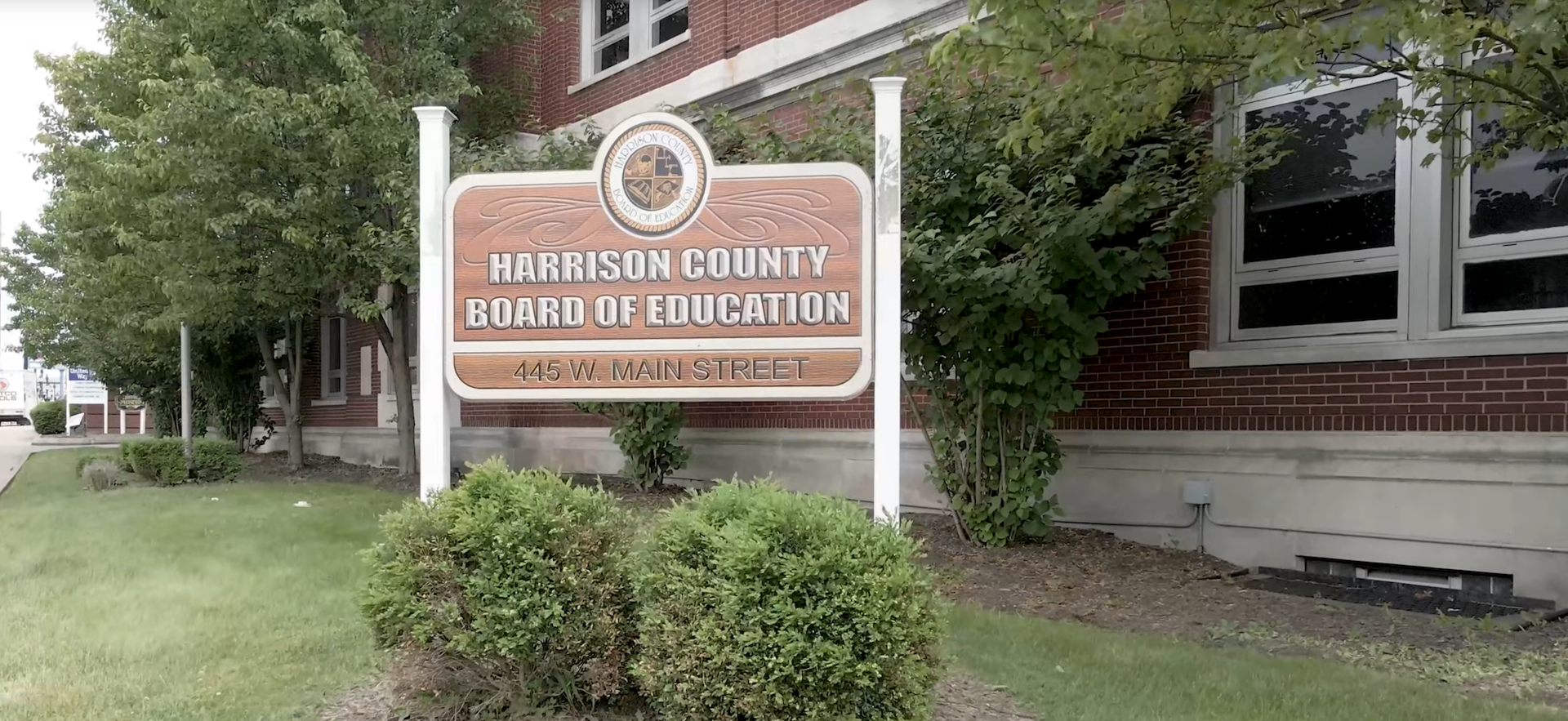 Front side of Harrison County Board of Education building show the board sign.