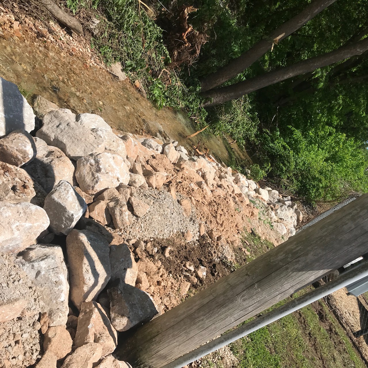EAST PARKING LOT DRAINAGE DITCH DEBRIS