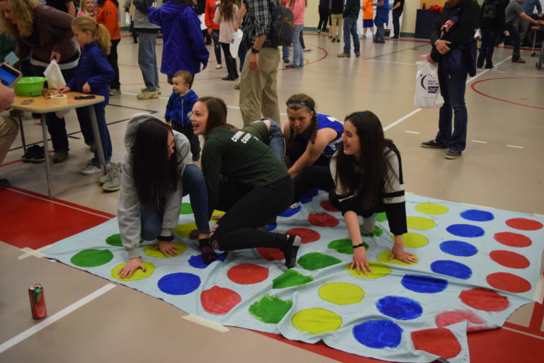 Student playing twister