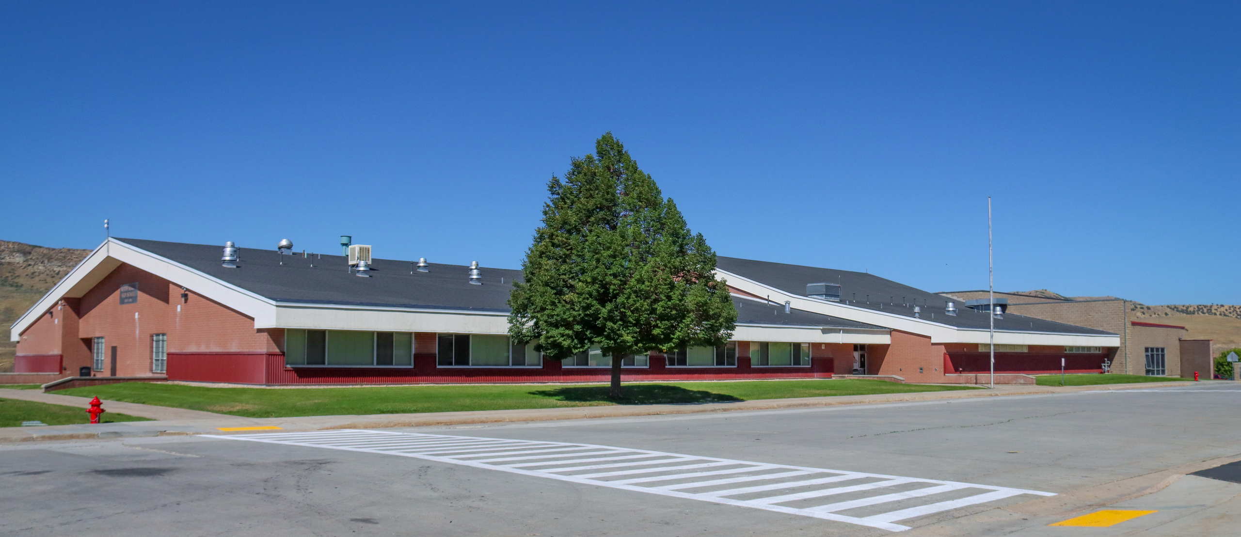 Front Entrance of North Summit Middle school with a tree in front