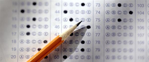 photo of a pencil and test answer sheet
