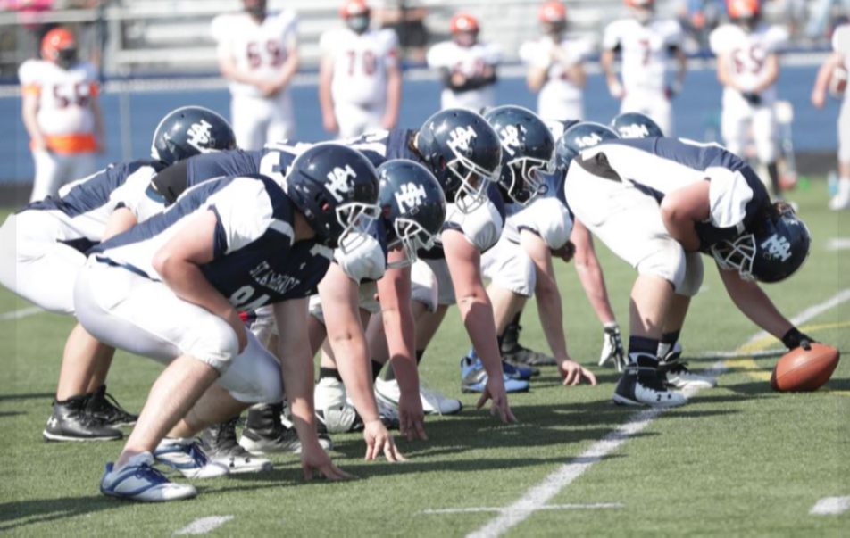 SLC football team lines up on offense