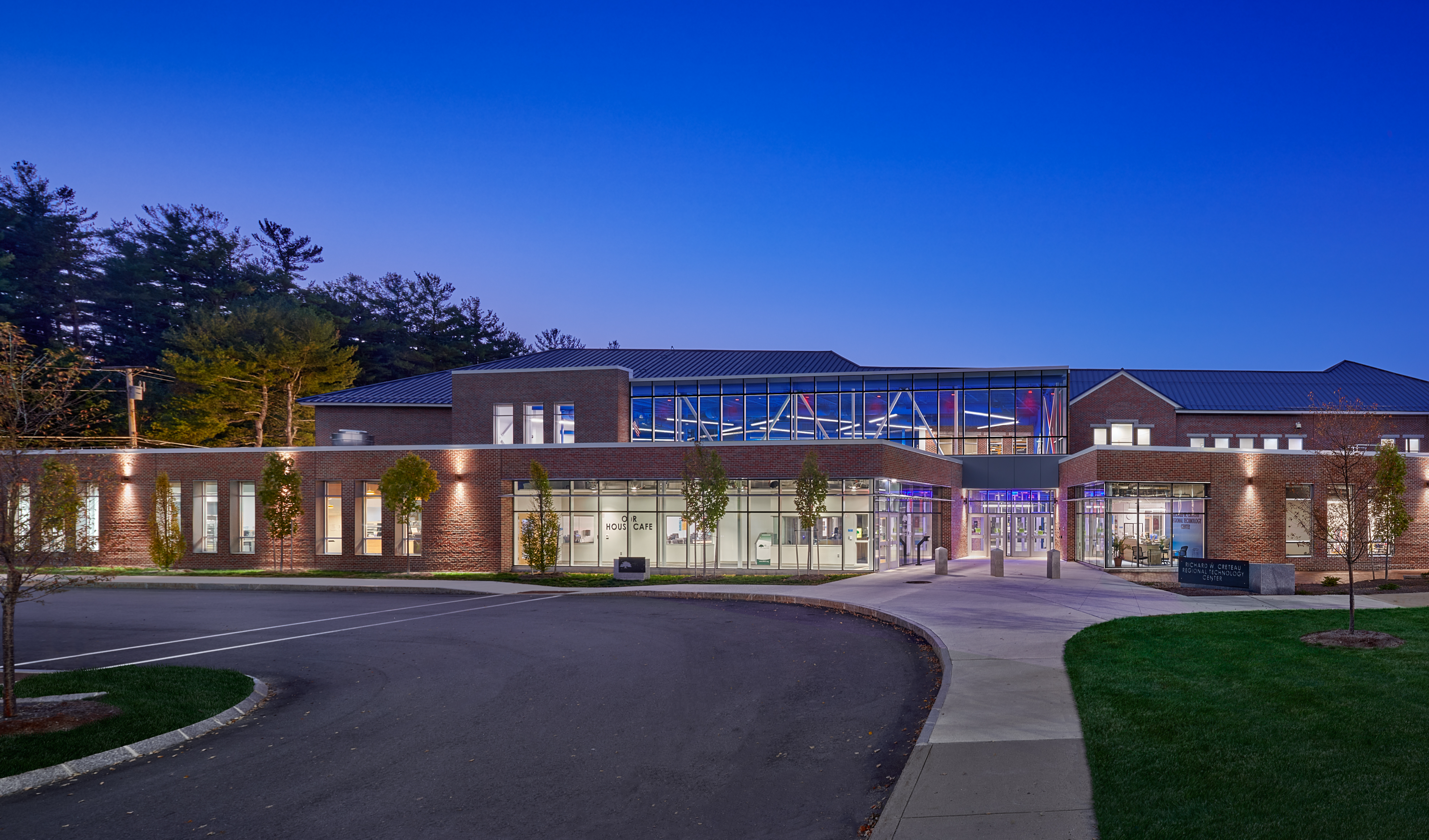 An image of the outside of the R.W. Creteau Technology center with the building all lit up!