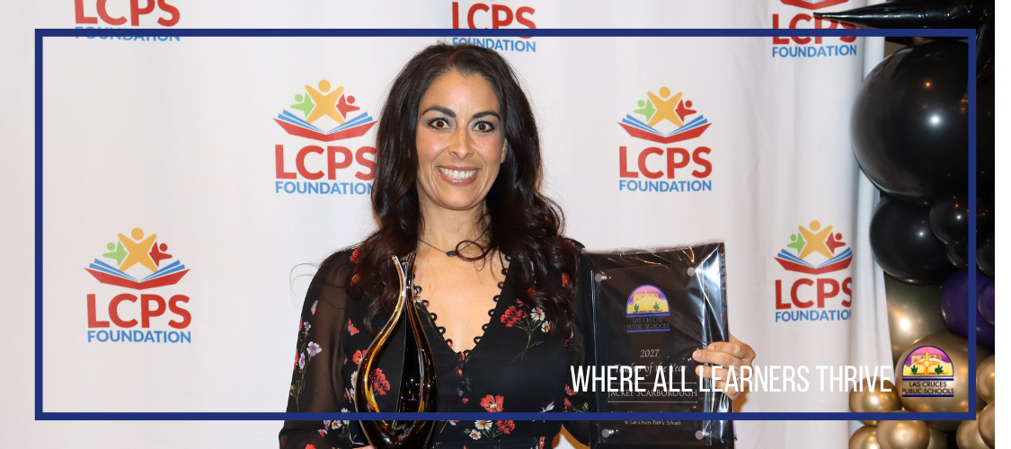 photo of woman holding award