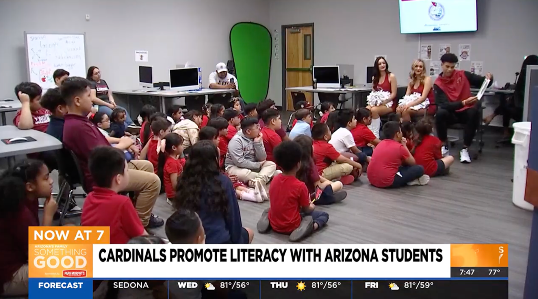 Students, staff, and Arizona Cardinals players come together to promote reading at their school