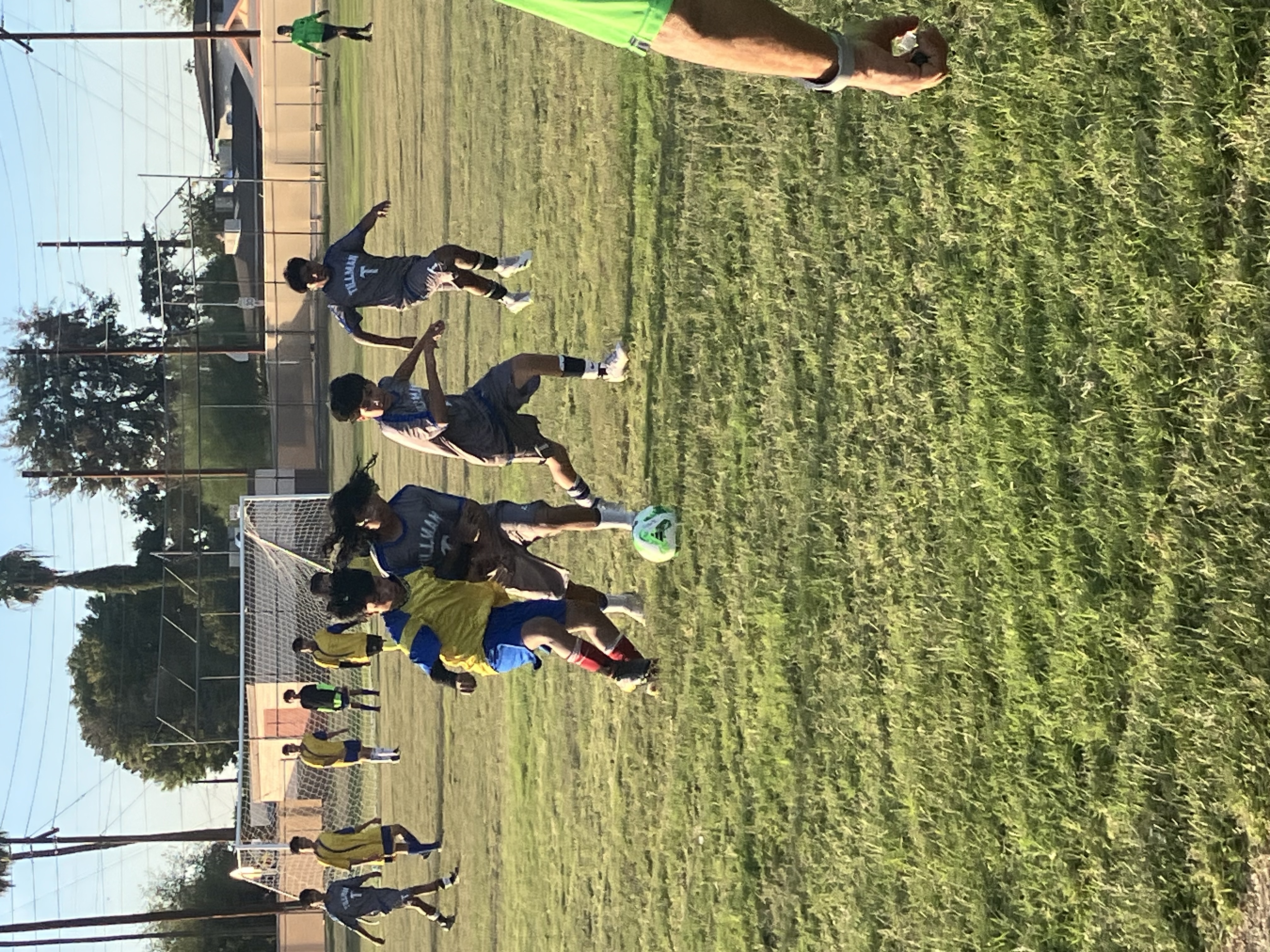 Boy students playing soccer