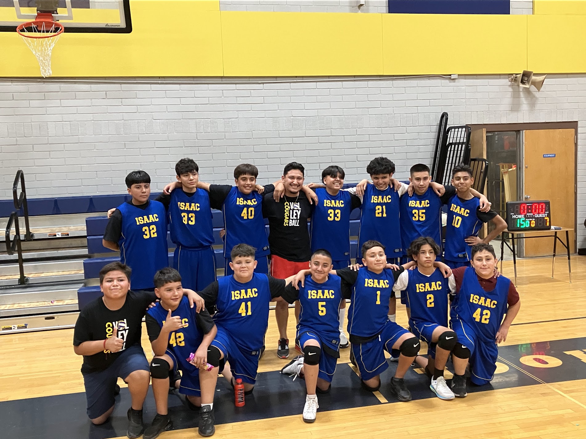 Boy volleyball students taking a group photo