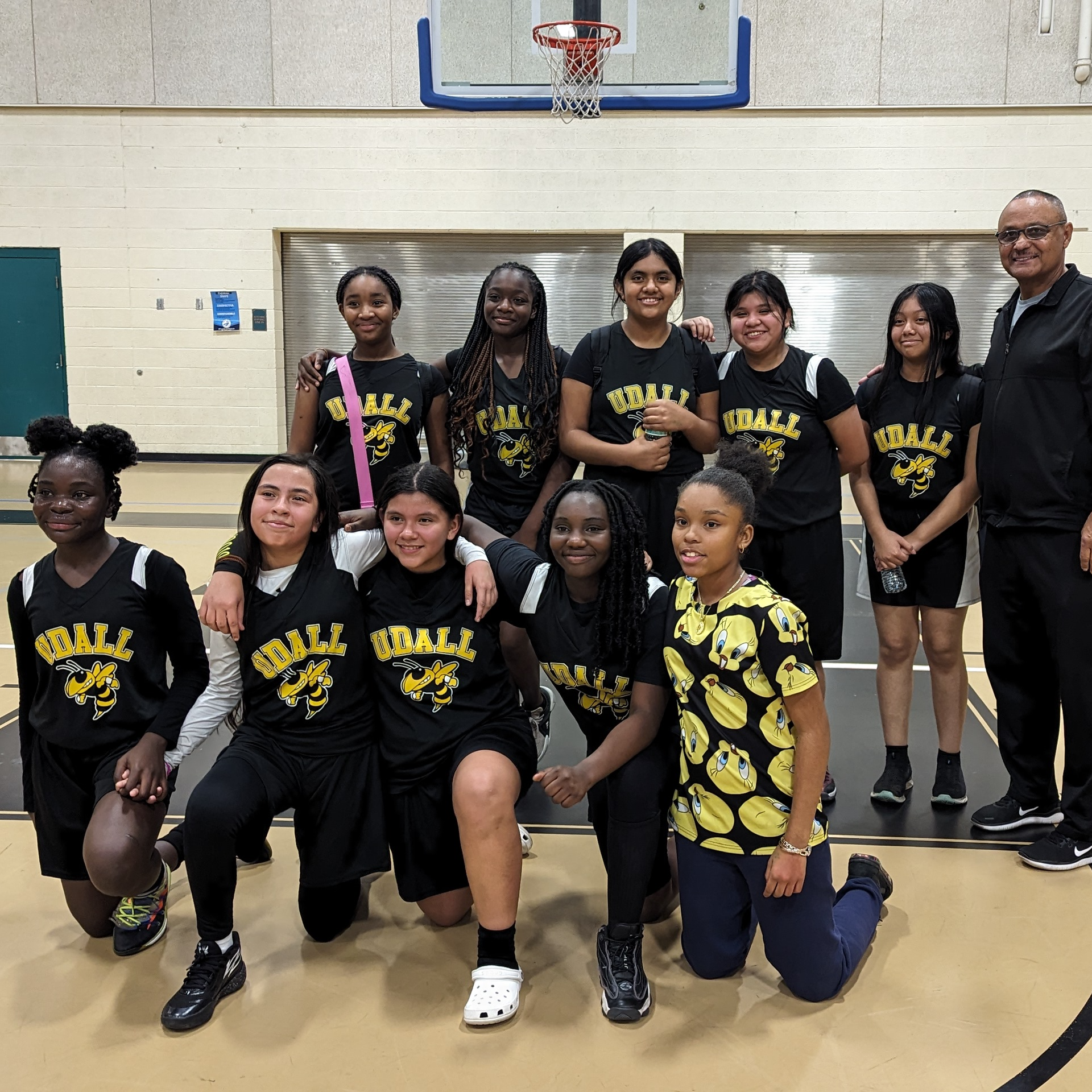 middle school girls basketball team and coach