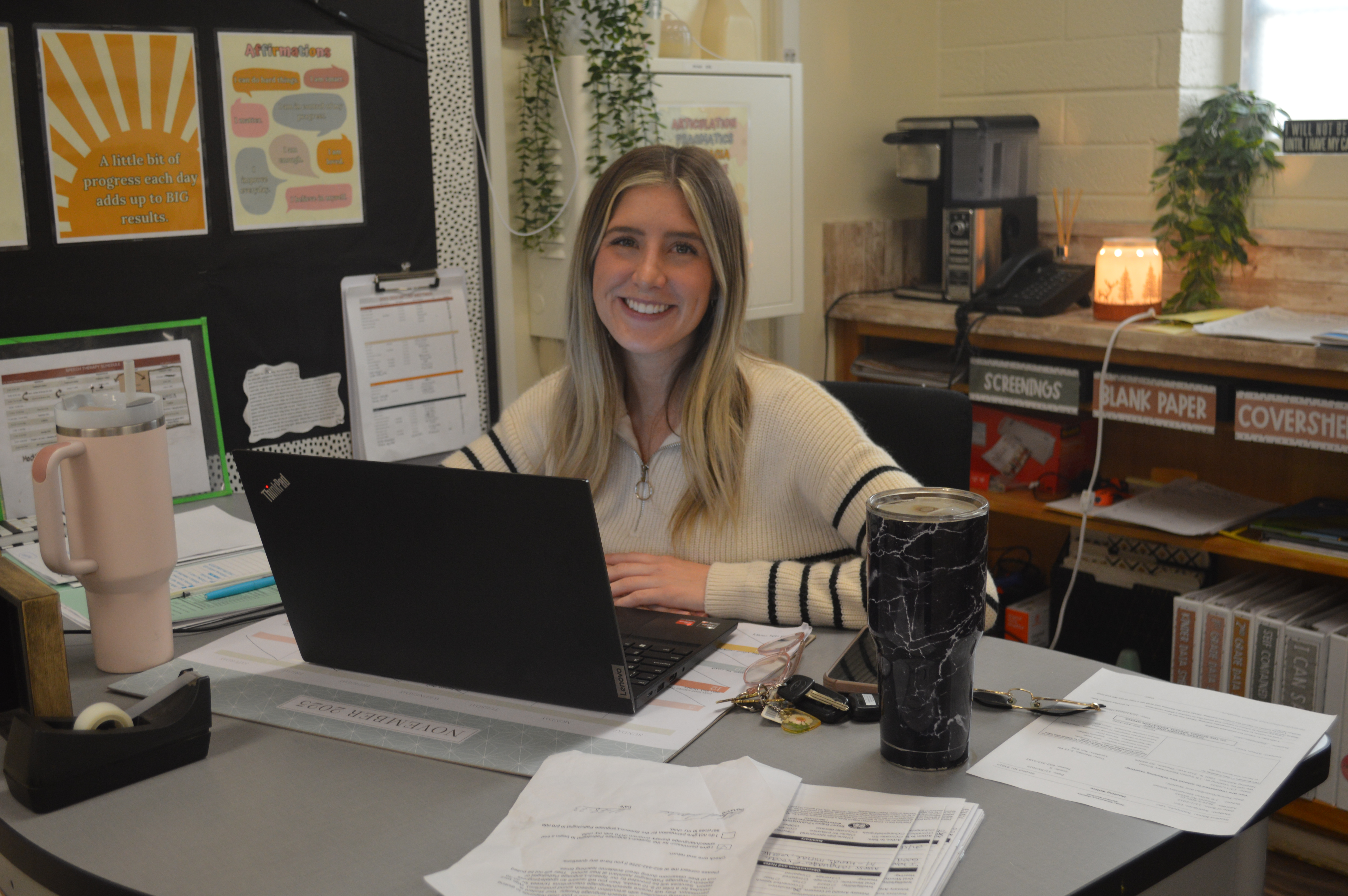 teacher at desk