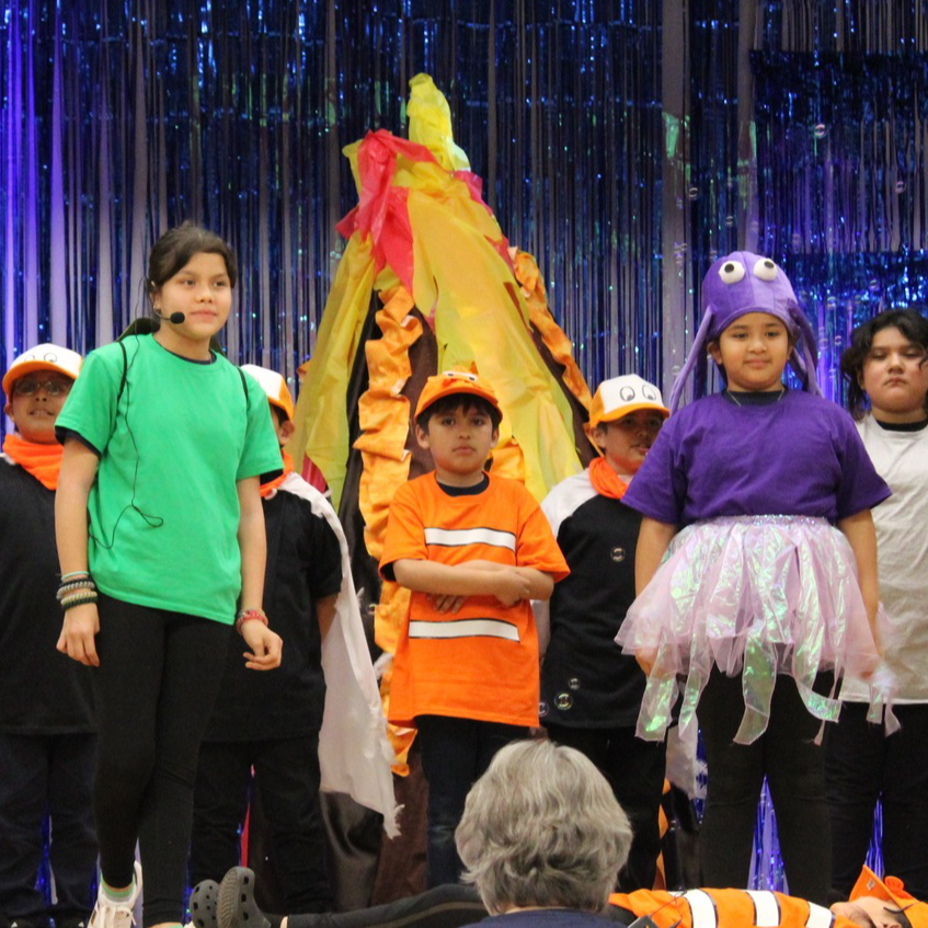 Elementary students performing play on stage
