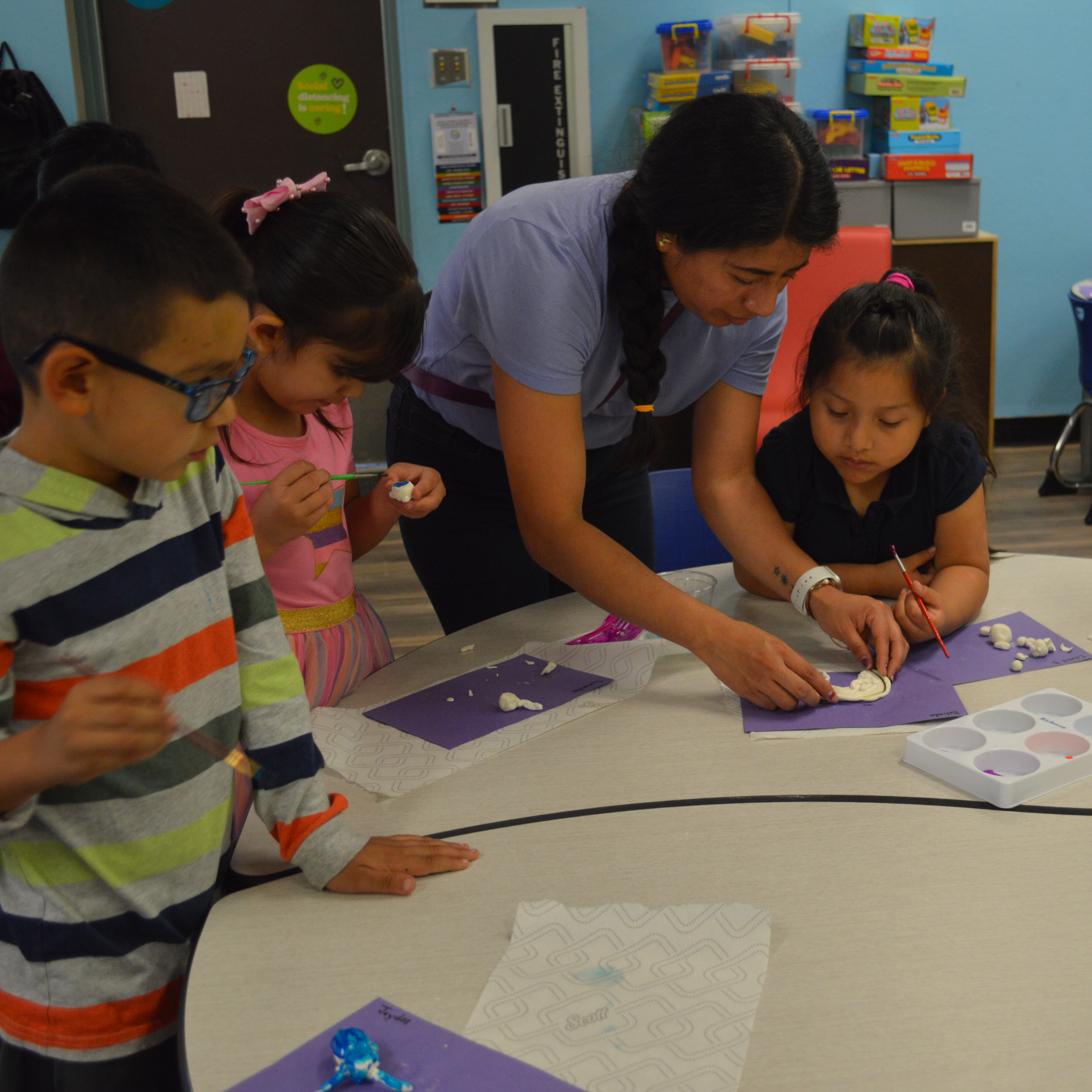 elementary student pose for photo in art class