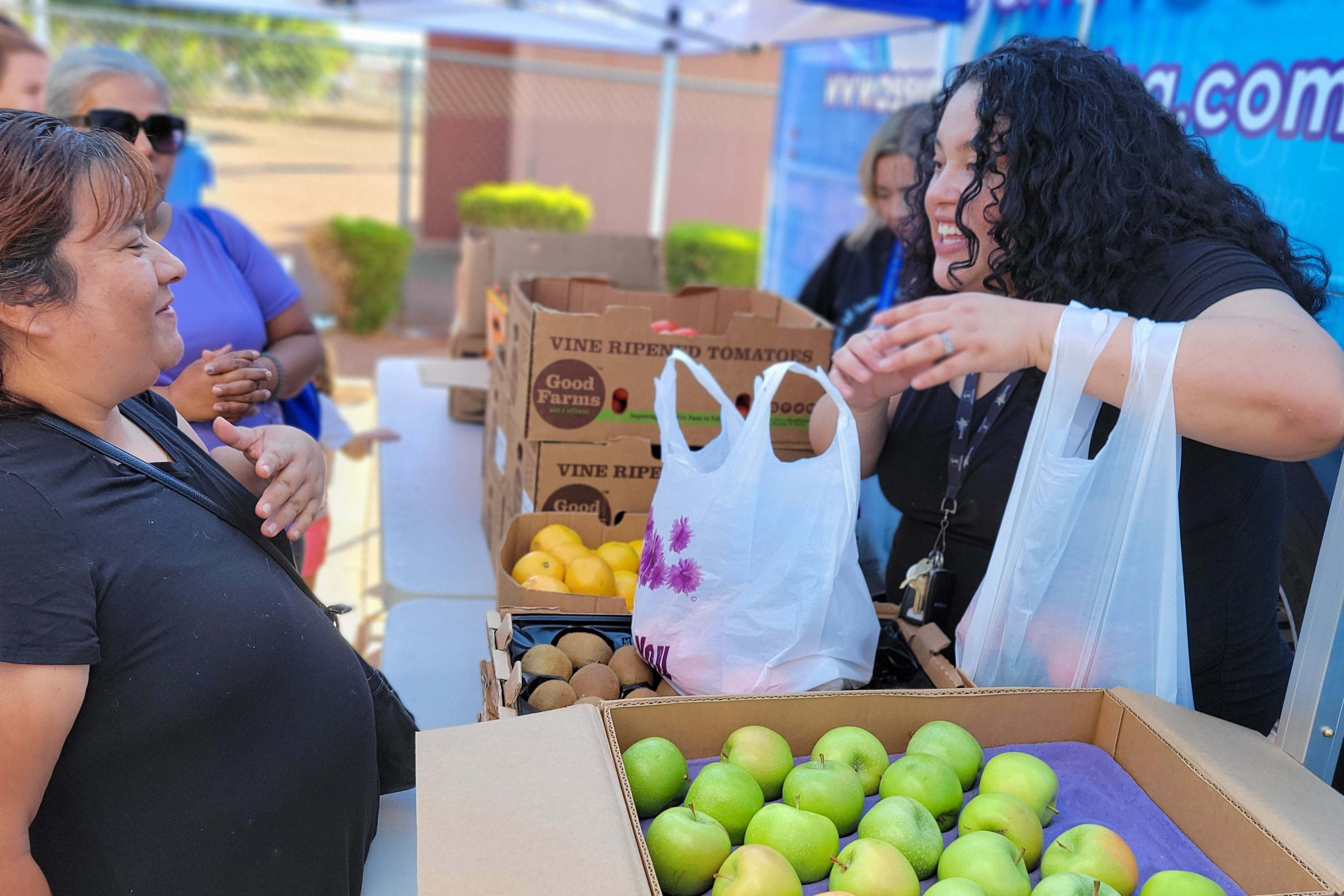 Heart of Isaac staff helping community member