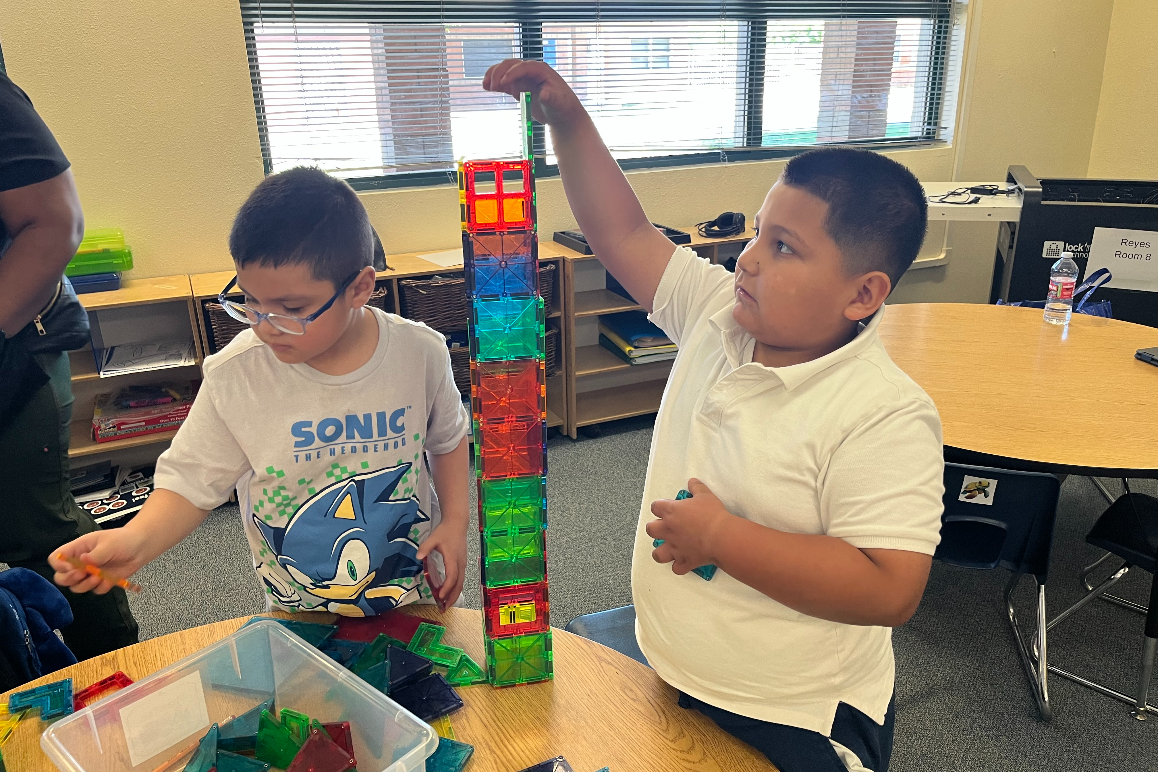 two ISD students solving a tower puzzle