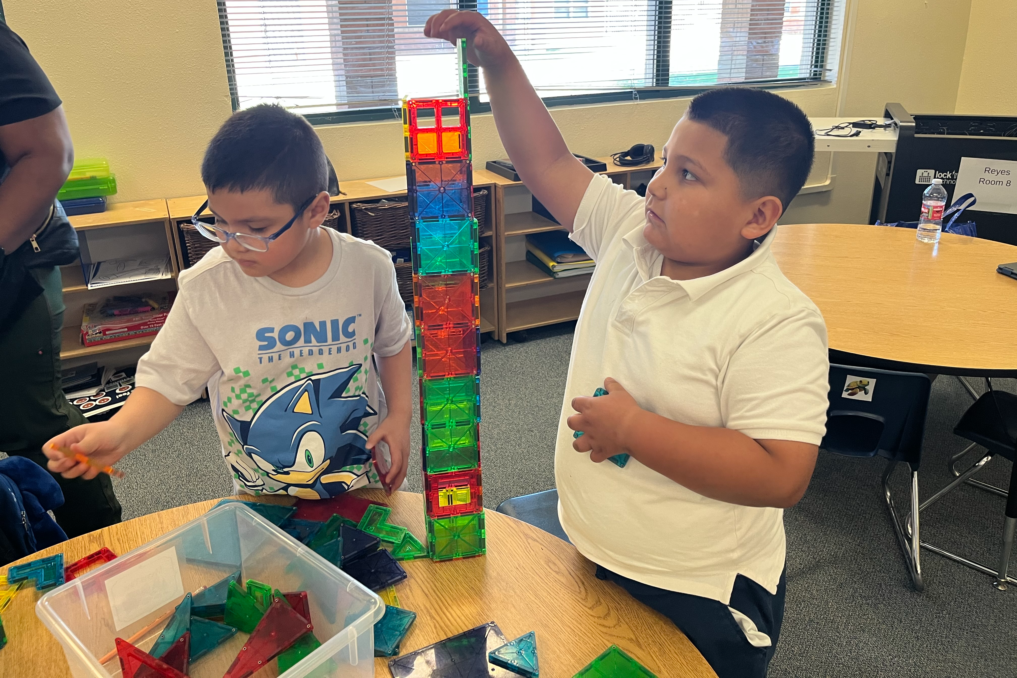 two ISD students solving a tower puzzle