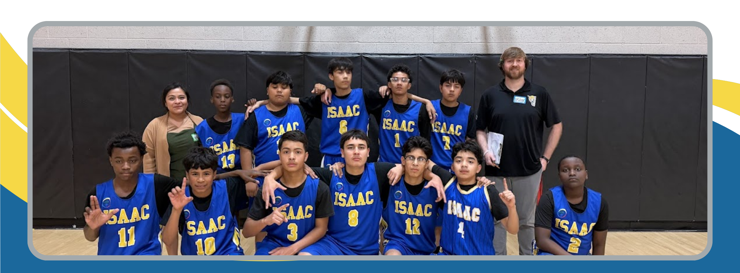 In the photo is the IMS basketball team, posing in their uniforms alongside their coach, Mr. Kelson, after a game.