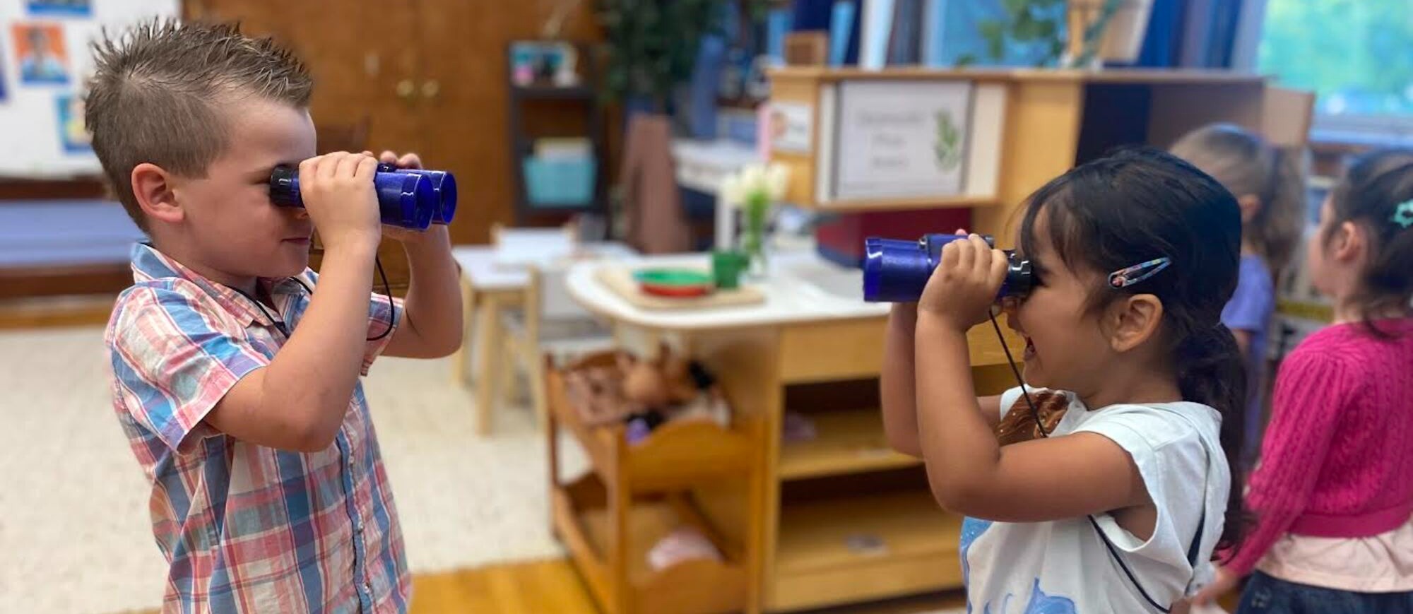 Barstow Students looking through binoculars at each other