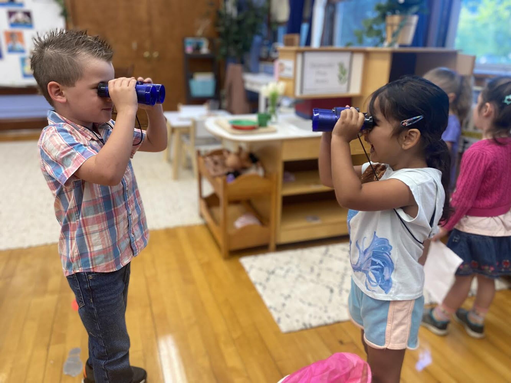 Barstow Students looking through binoculars at each other