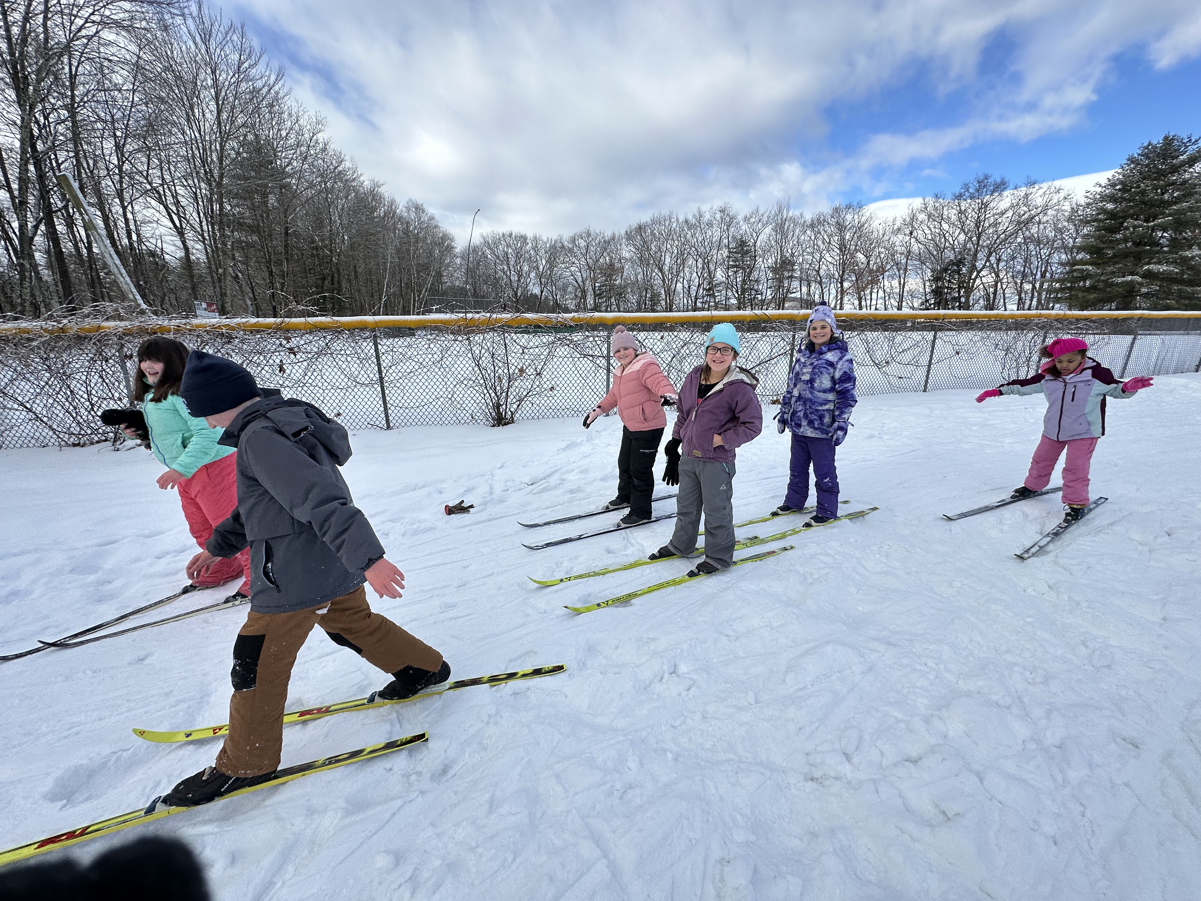 Children cross country skiing