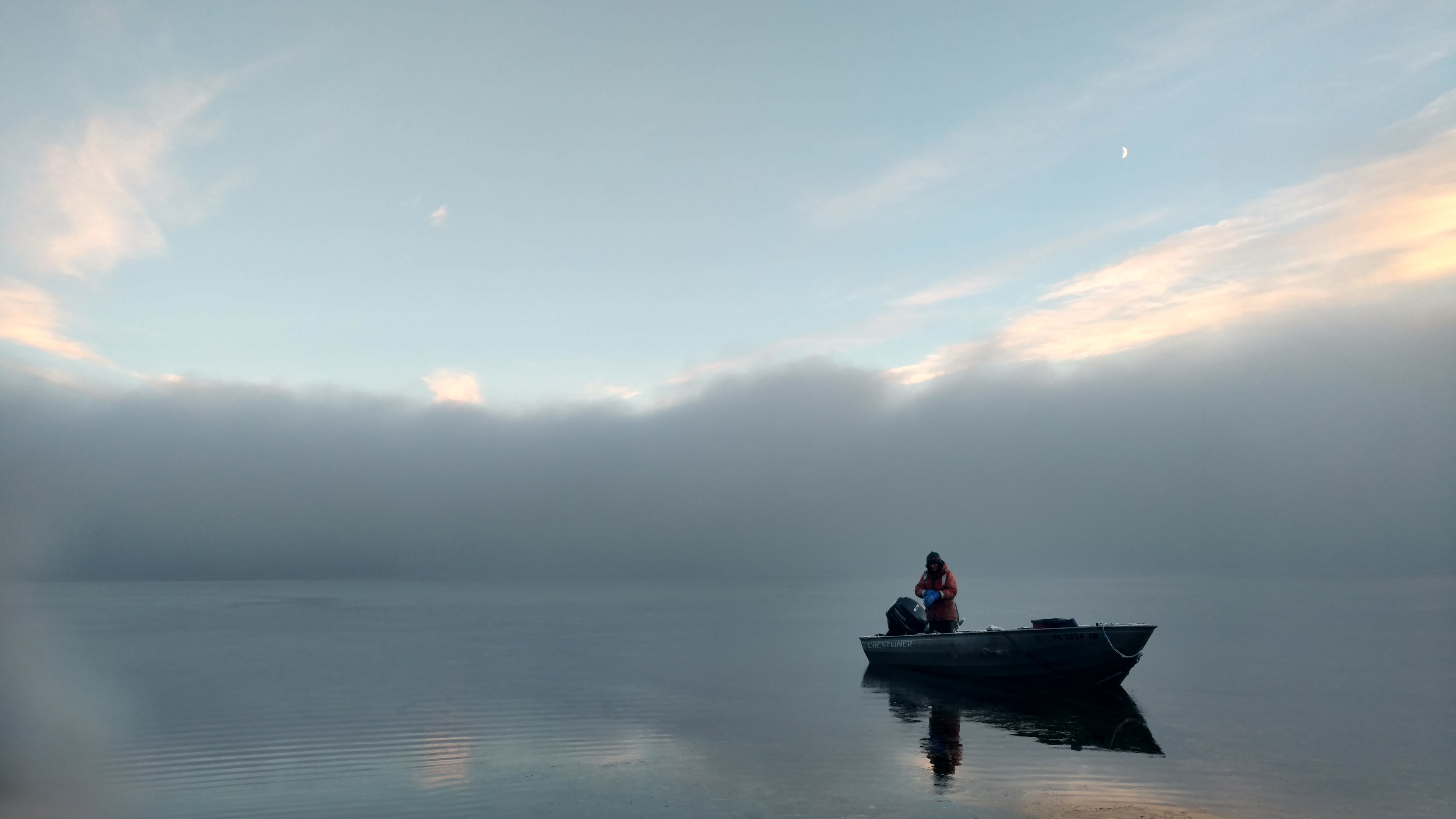 Person in a boat on water in Alaska