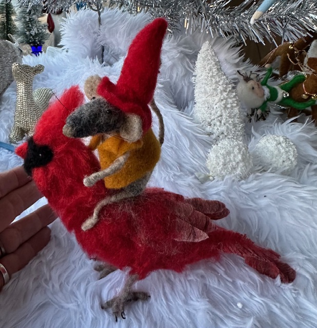 Stuffed mouse riding stuffed cardinal toy