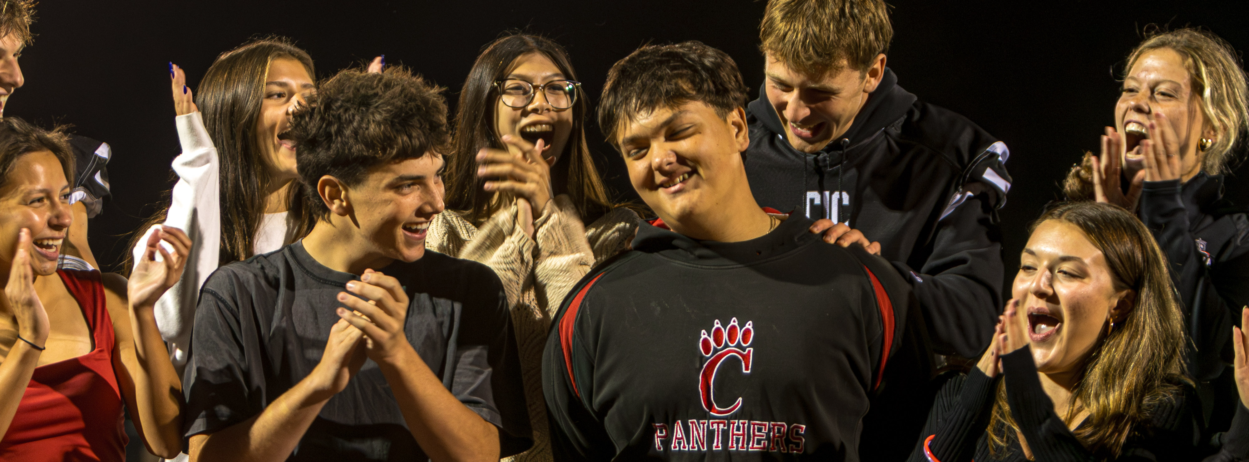 Chatham homecoming court celebrating announcement of homecoming king