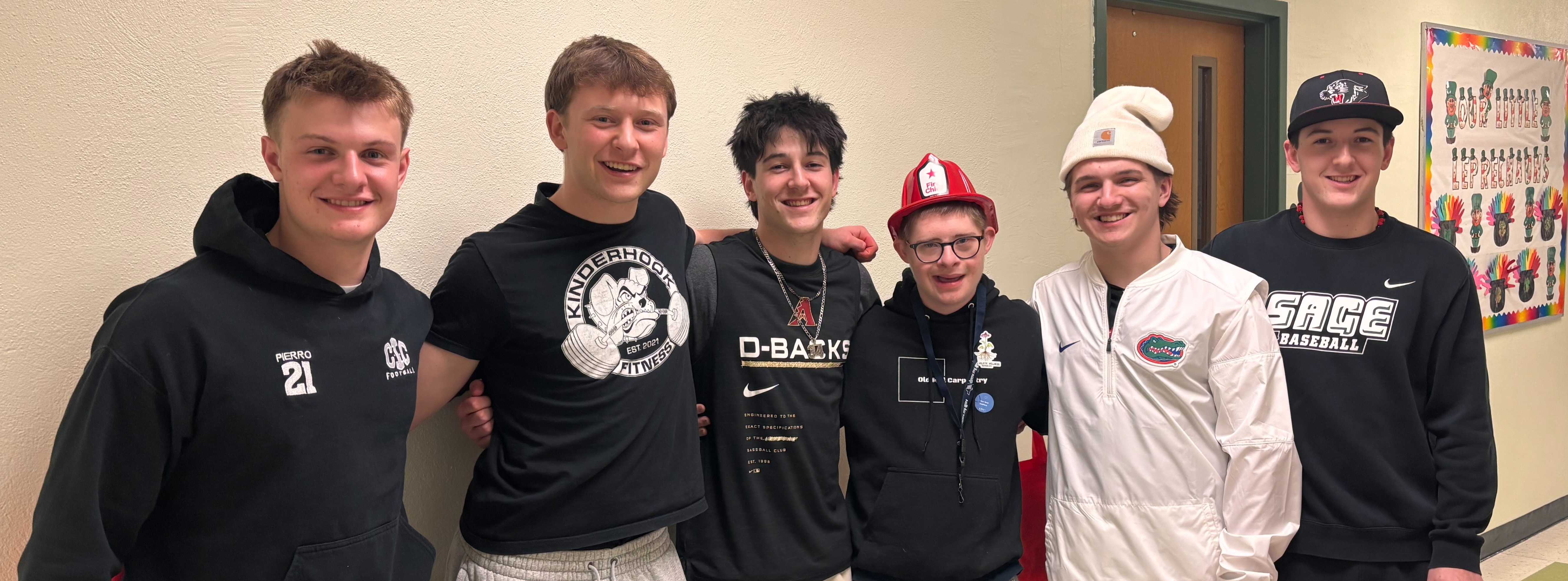 six teenage boys smiling for group photo