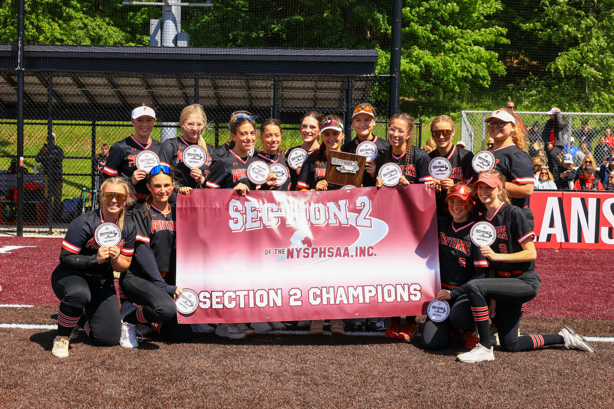 CHS softball team with  Section 2 championship banner