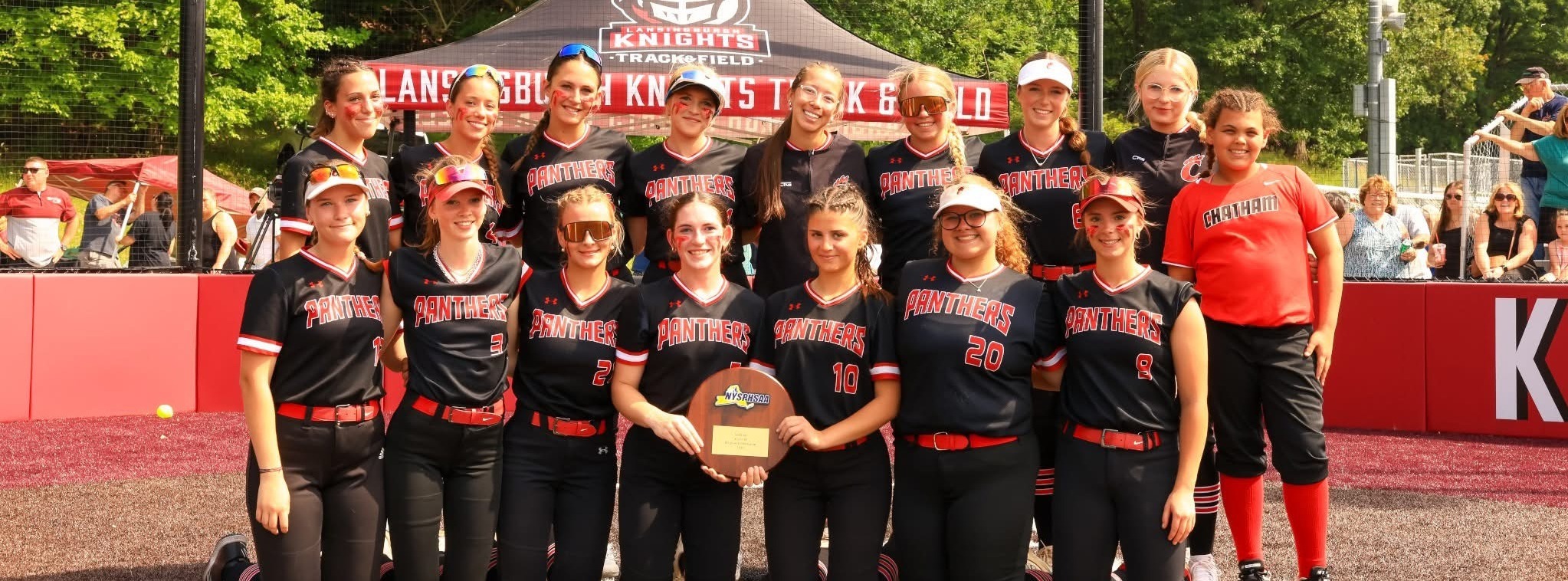 CHS softball team with  reginal championship plaque