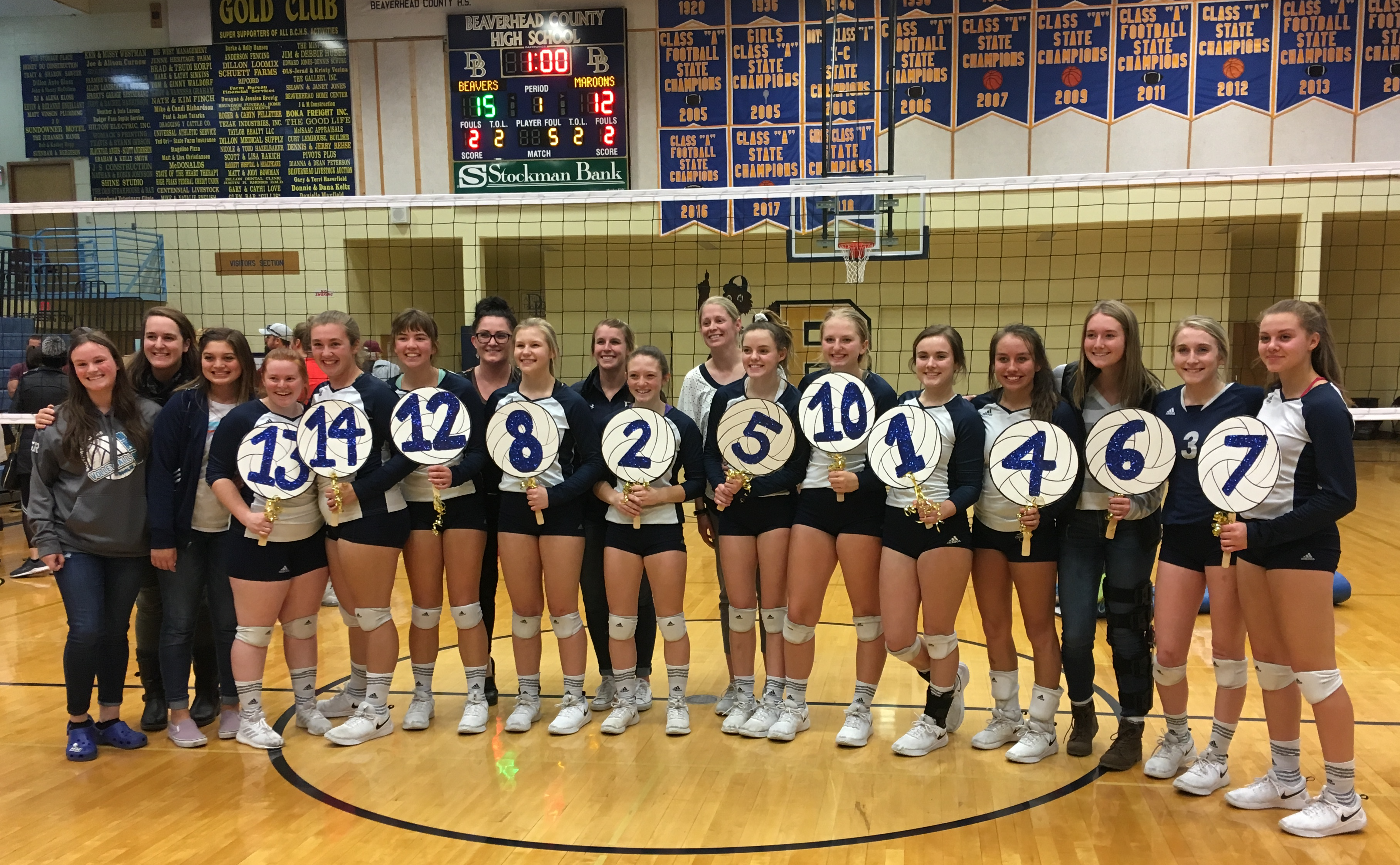 A photo of the Varsity volleyball team celebrating their third place finish at Districts in October 2019