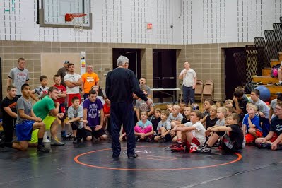 Olympian Ben Peterson works with area wrestlers at a Whitehall Clinic.