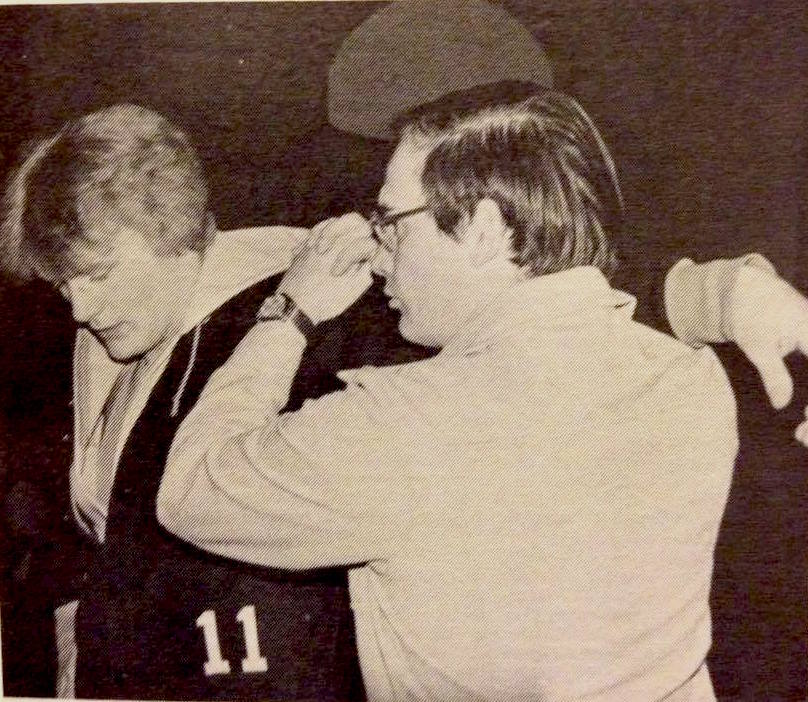 Coach Brickner getting Bruce Berg ready to wrestle. 