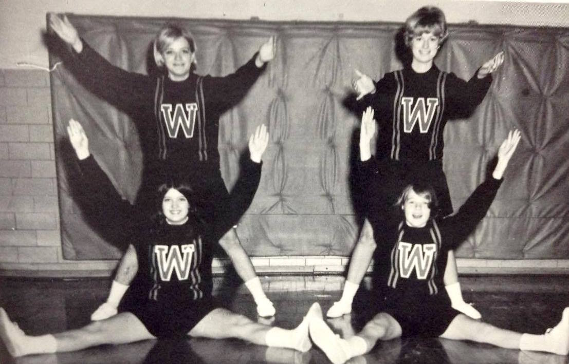 Cheerleaders: (Top L to R) Debbie Koepke, Kathy Hanson. (Bottom L to R) Barbie Bensend, Susie Gronemus.