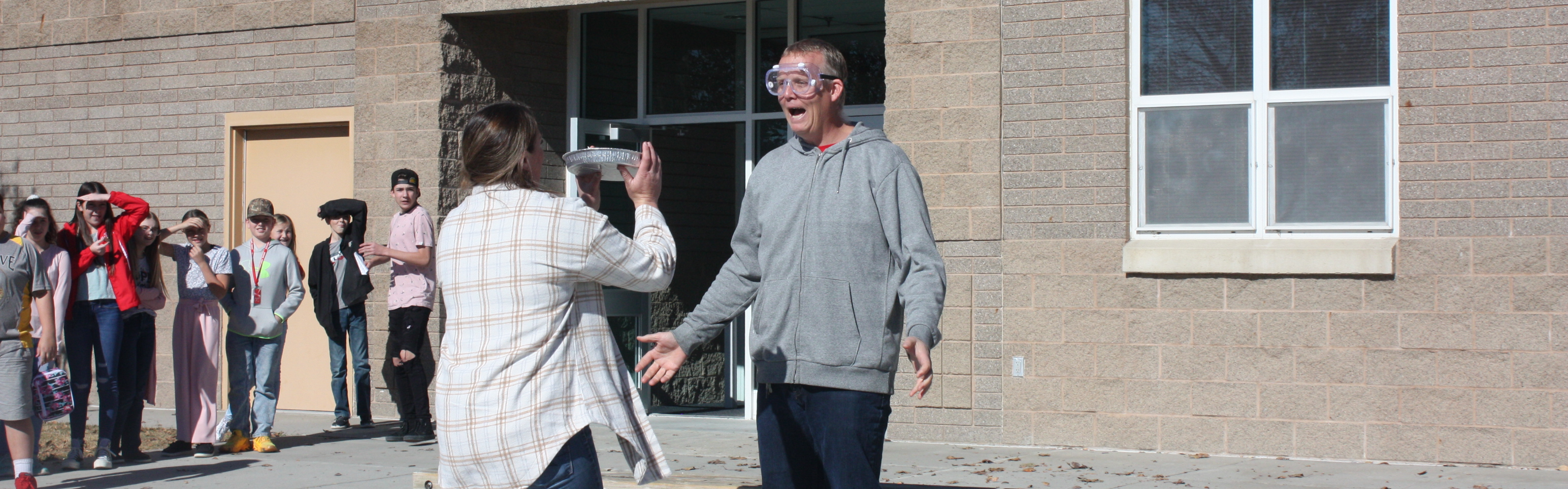 Mr. Lee's doesn't look excited about getting a pie to the face