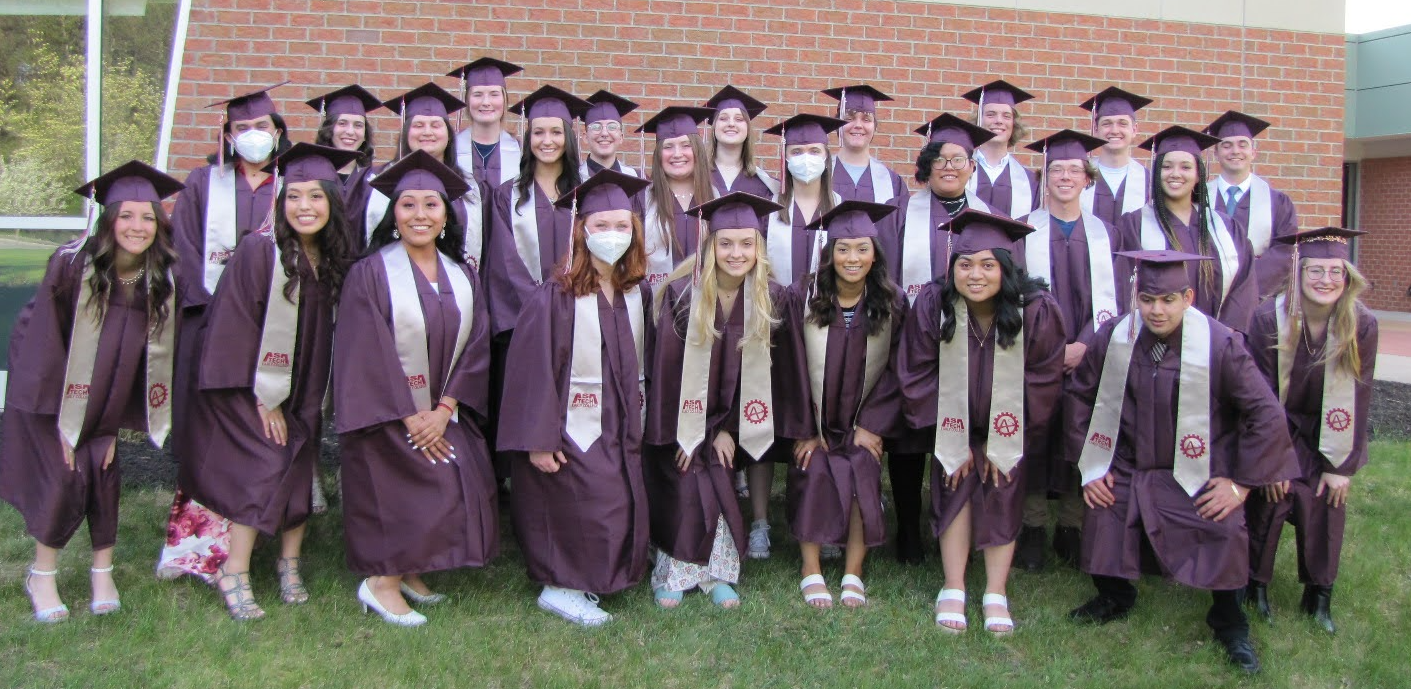 students in caps and gowns