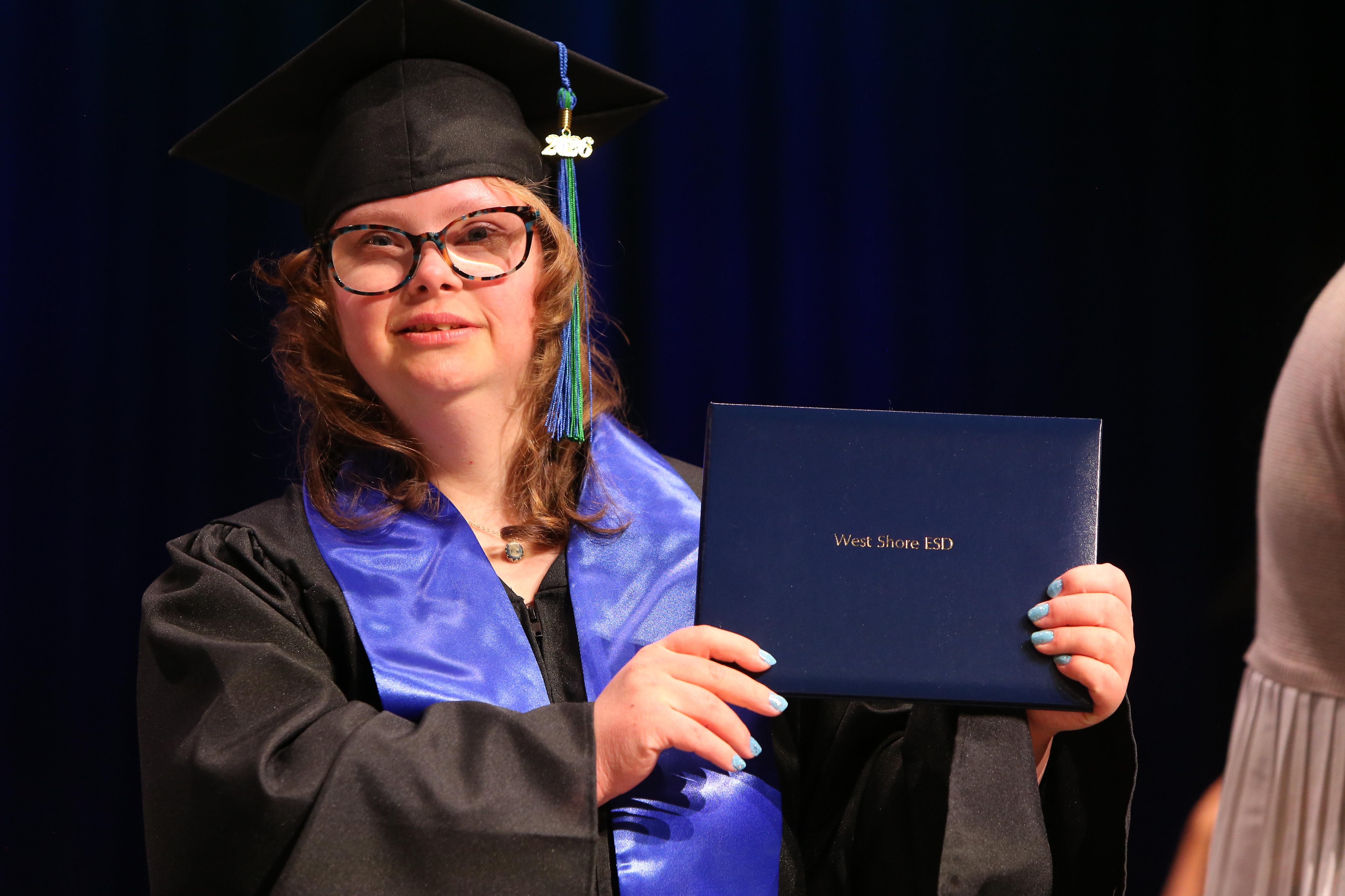Student holding a diploma