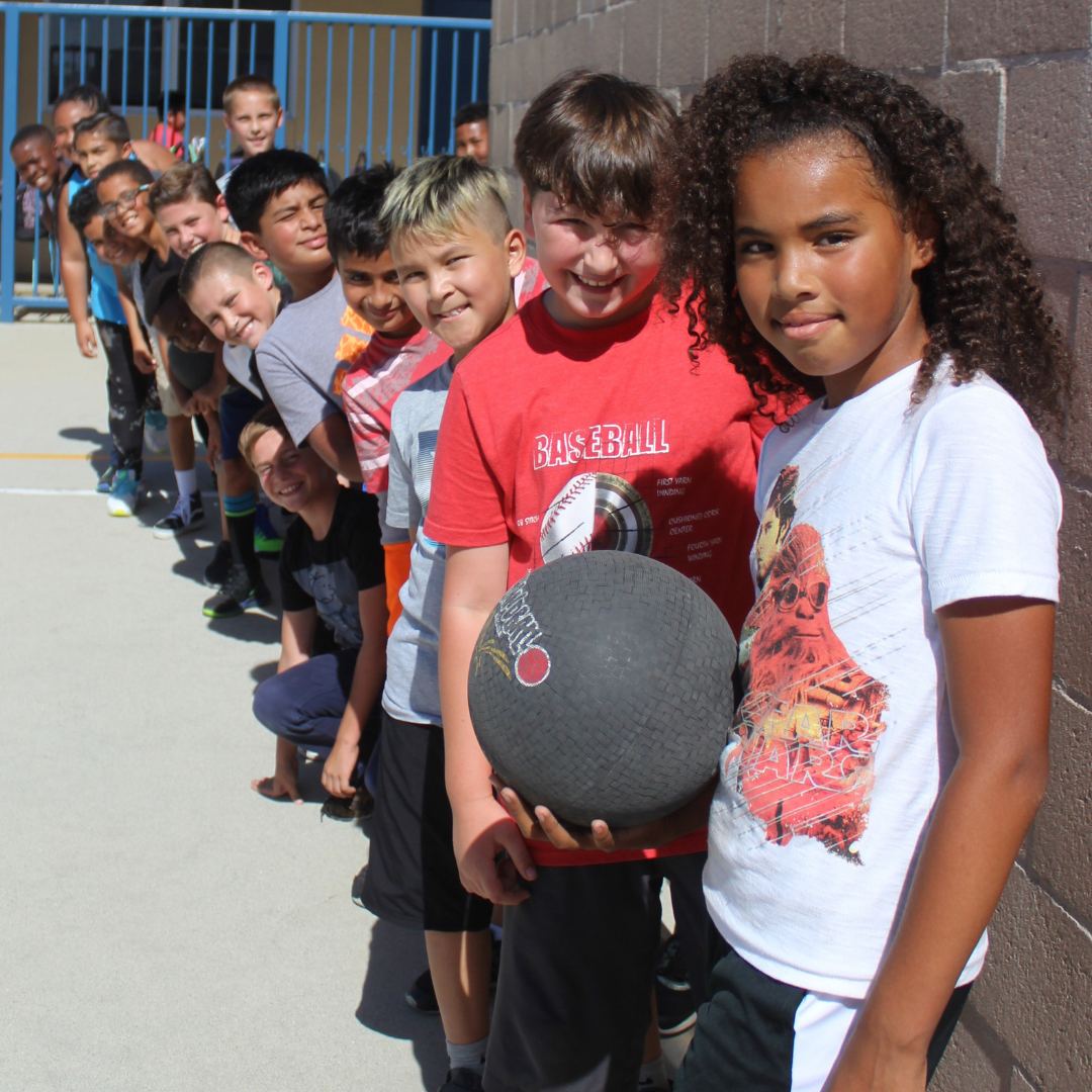 students outside with ball