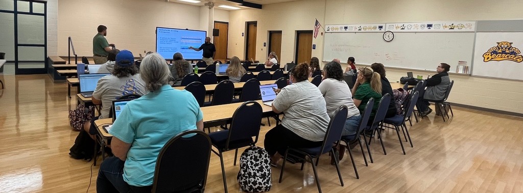 Teacher learn how to use the new grade book.