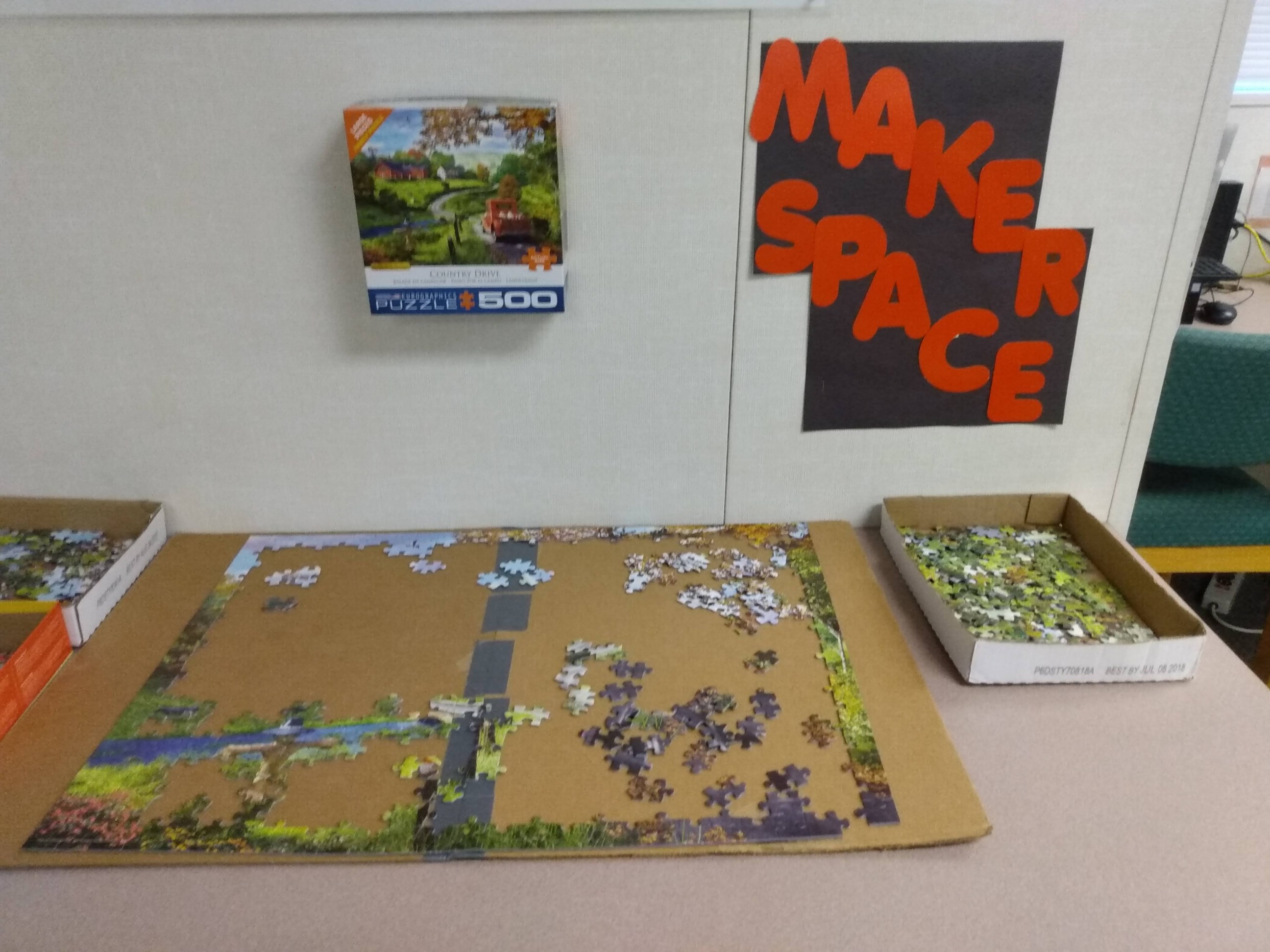 Incomplete puzzle on table from Maker Space