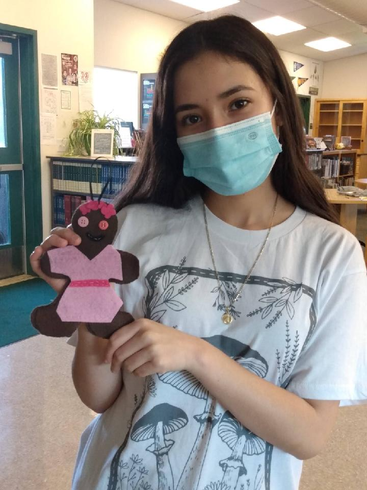 Student with Gingerbread Men Craft