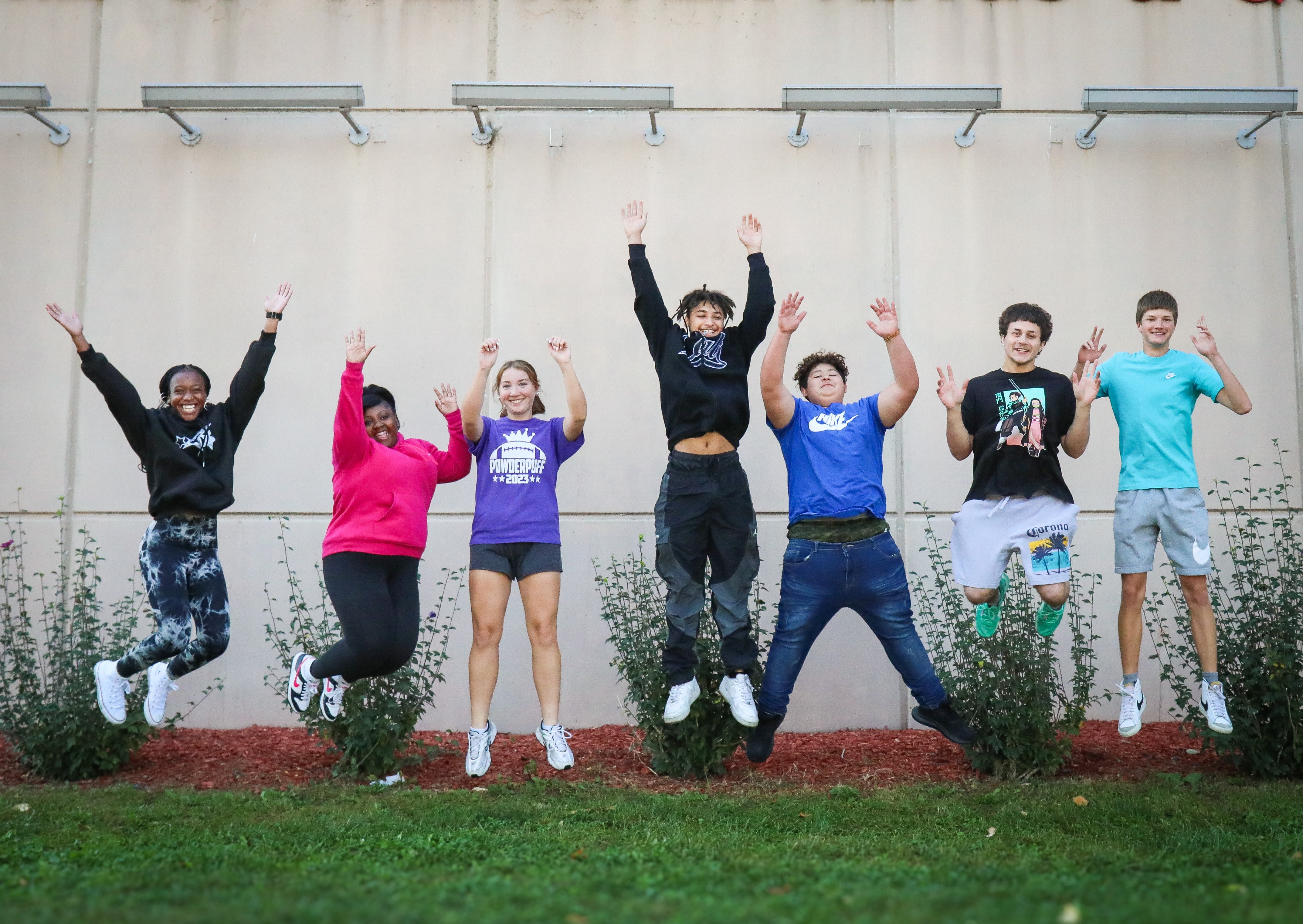 Students jumping outside CHS