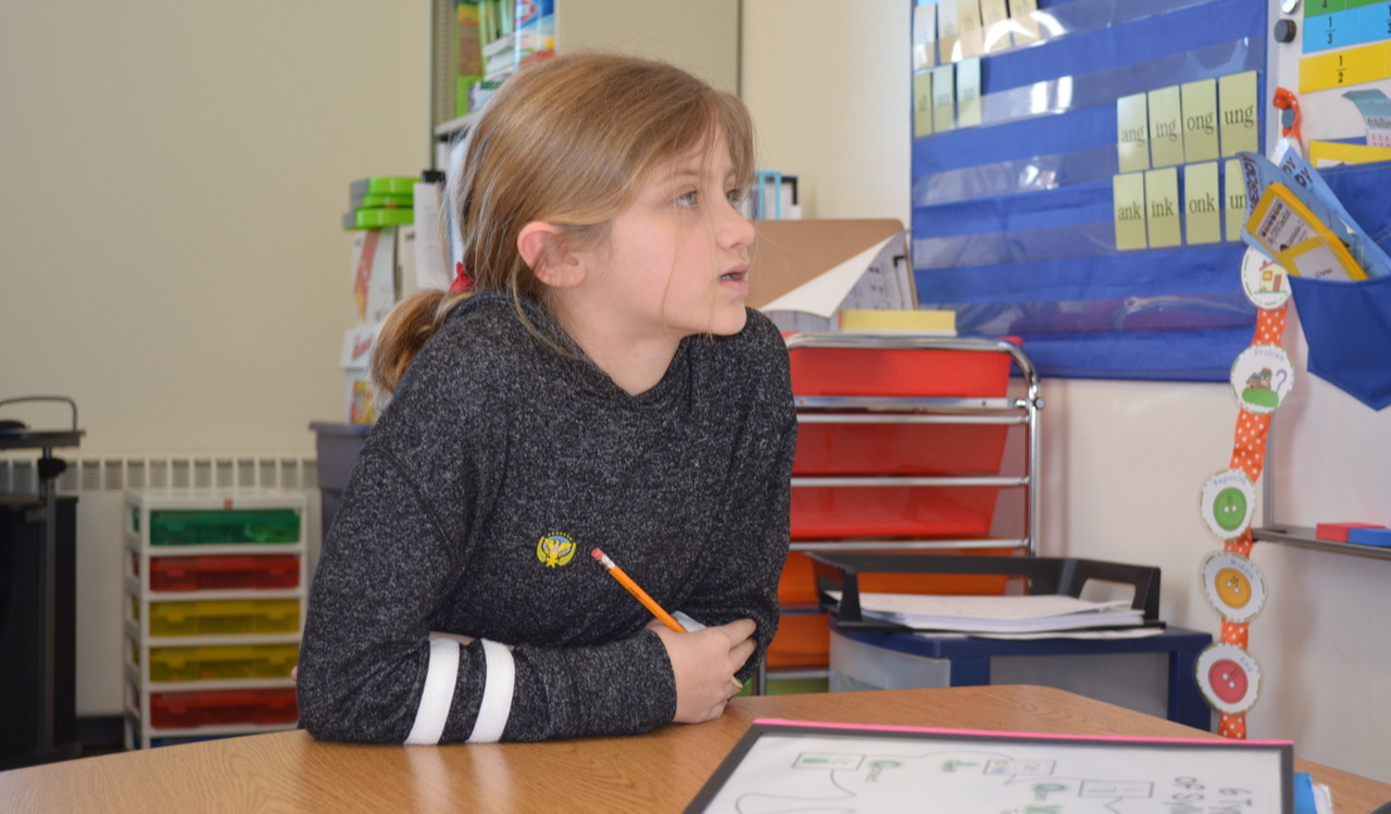 Student working in classroom.