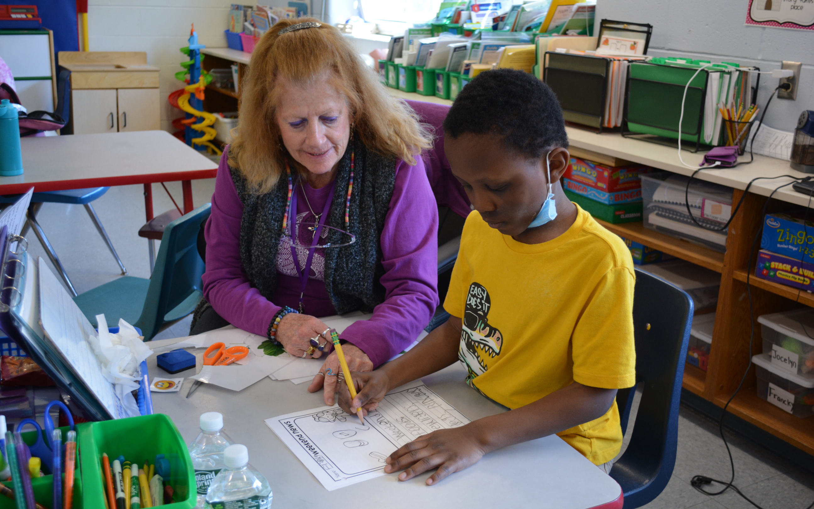 Student and teacher working together
